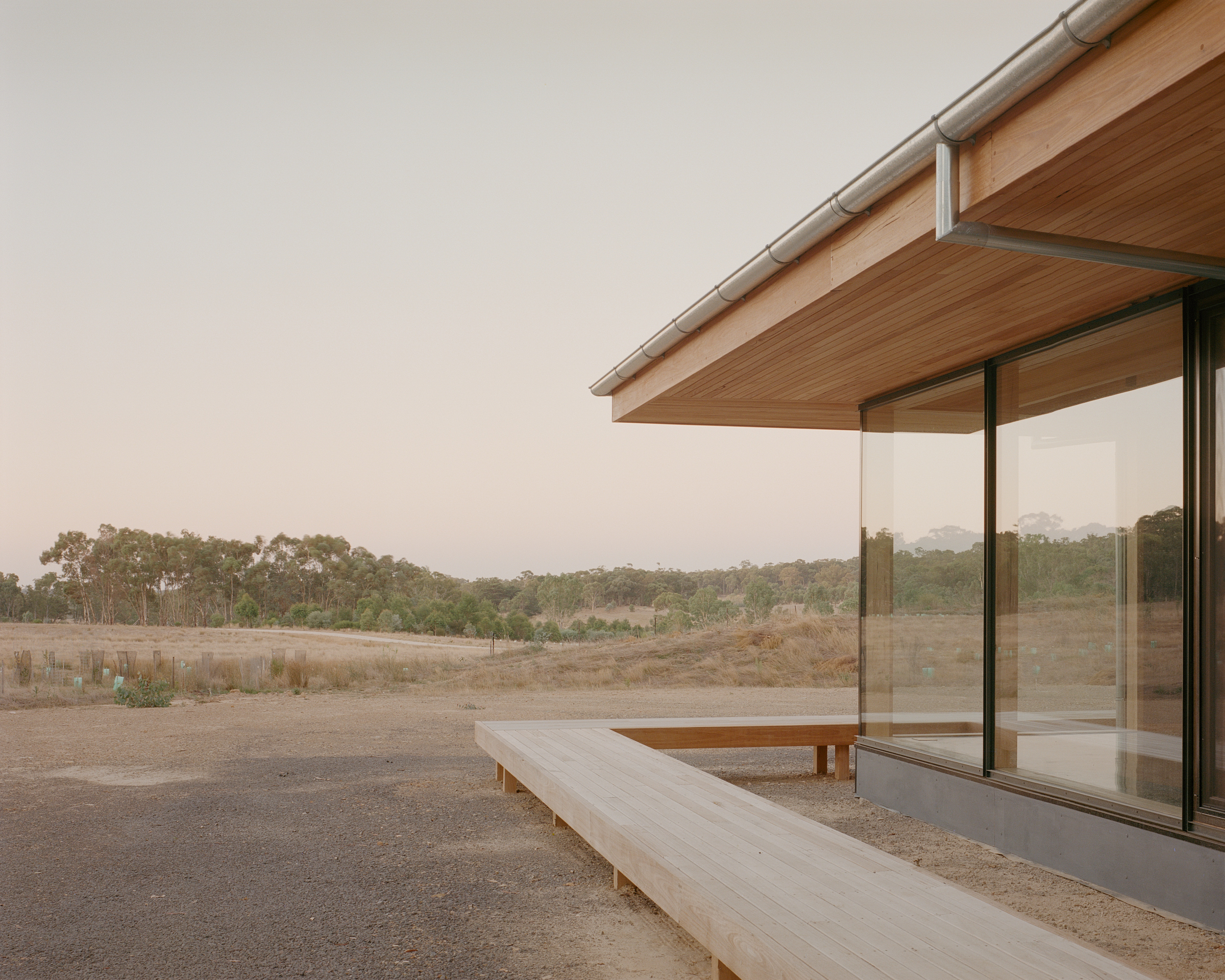 prefabricated fully glazed facade exposed timber ceiling
