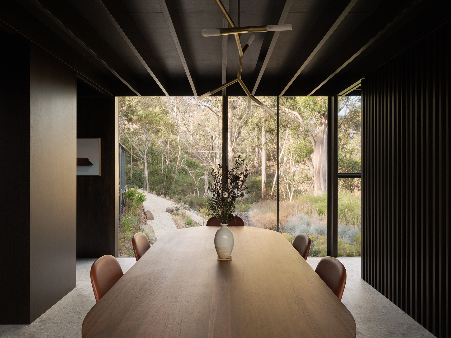 prefabricated steep site fully glazed facade exposed timber ceiling