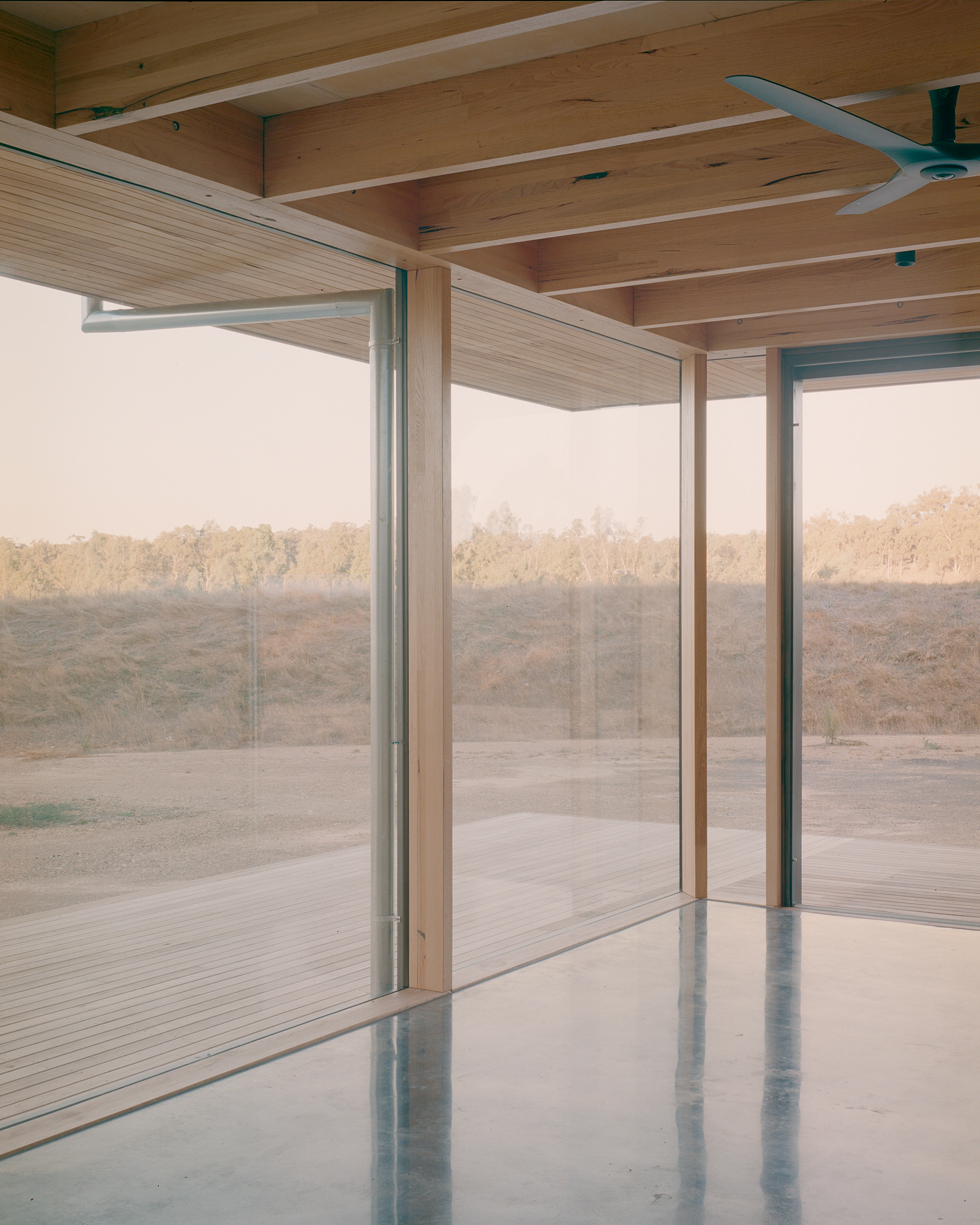prefabricated fully glazed facade exposed timber ceiling
