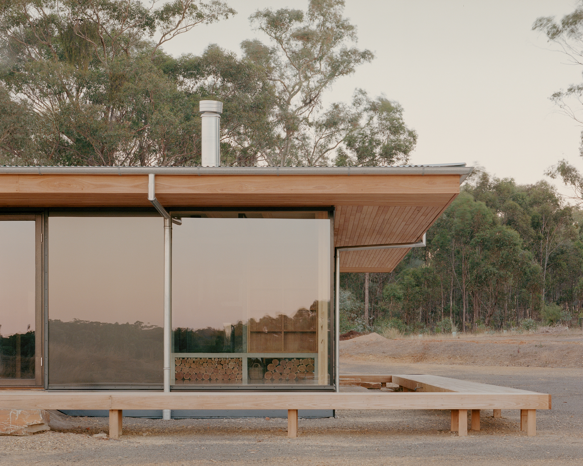 prefabricated fully glazed facade with large eave