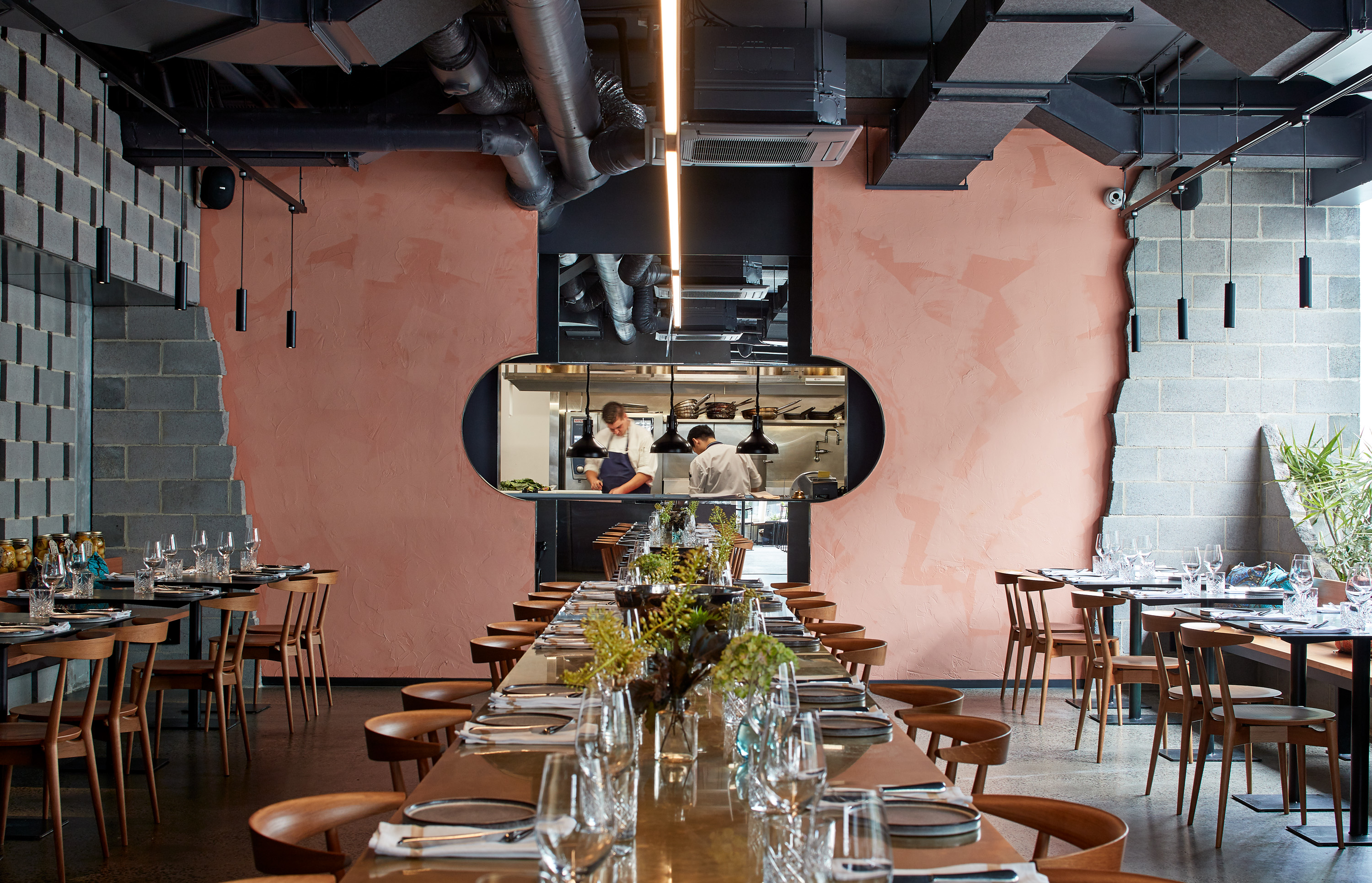 brass pendants over long dining tables