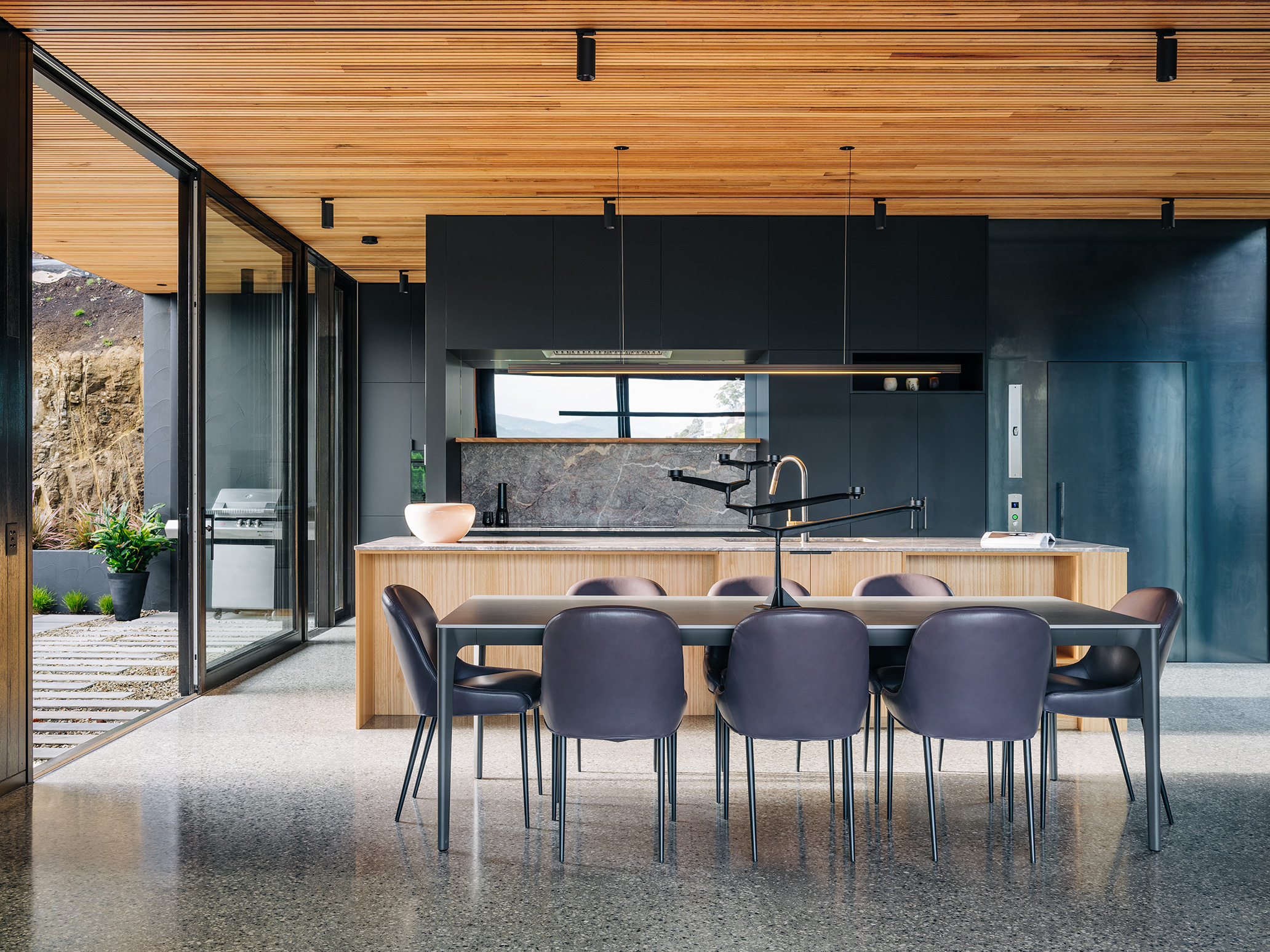 view from balcony towards kitchen which conceals a laundry behind it