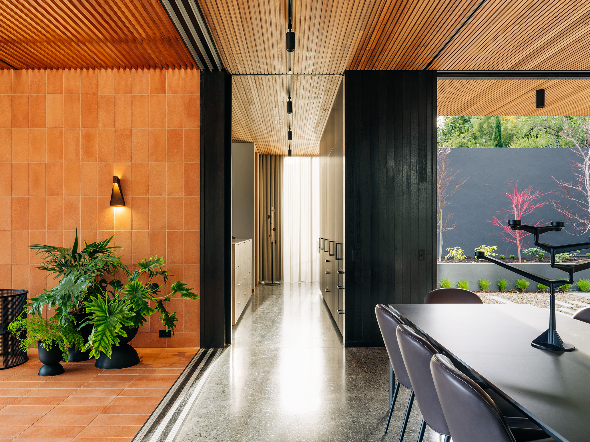 kitchen opening to terracotta balcony