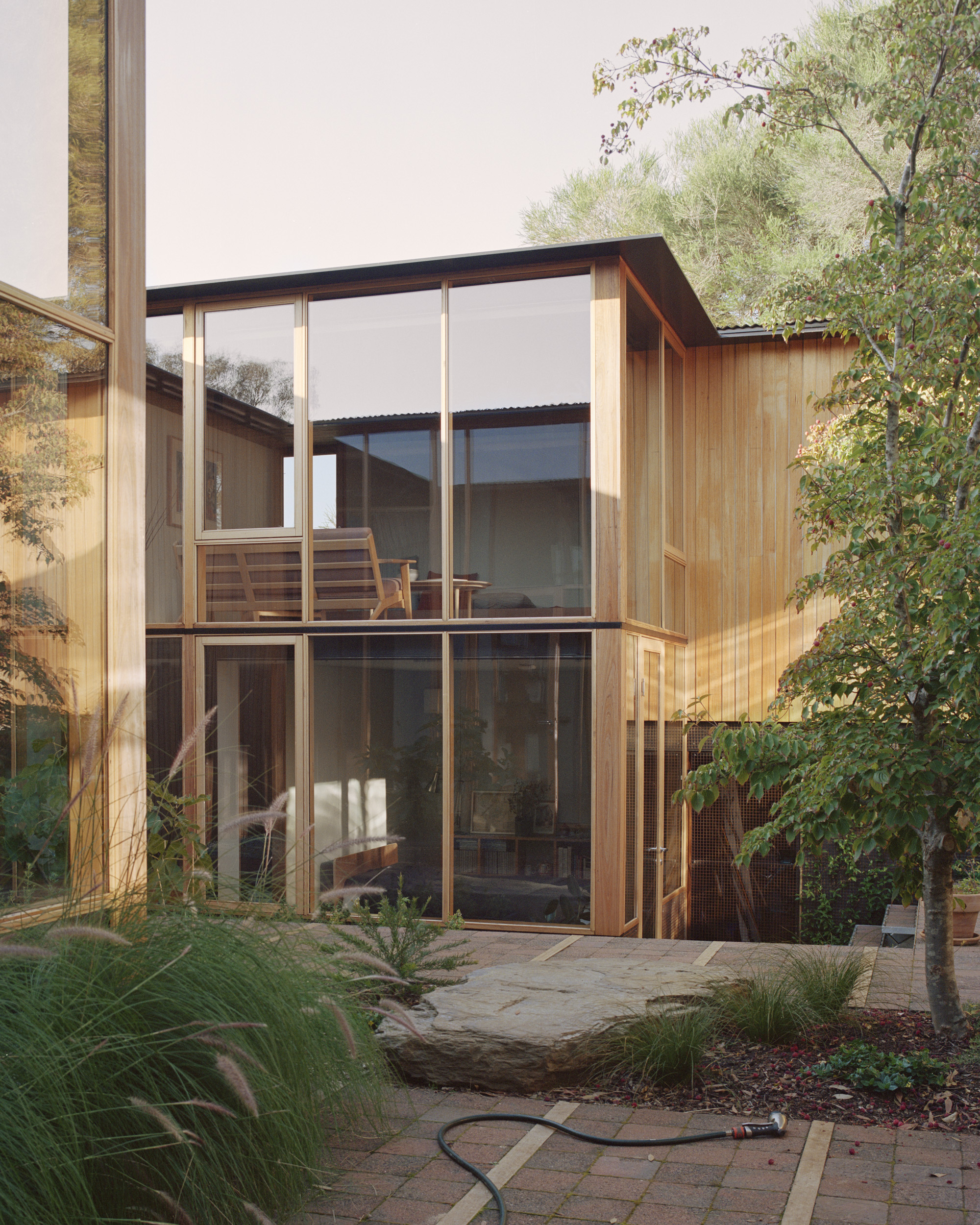 mid century architectural home with high ceilings and full height glazing