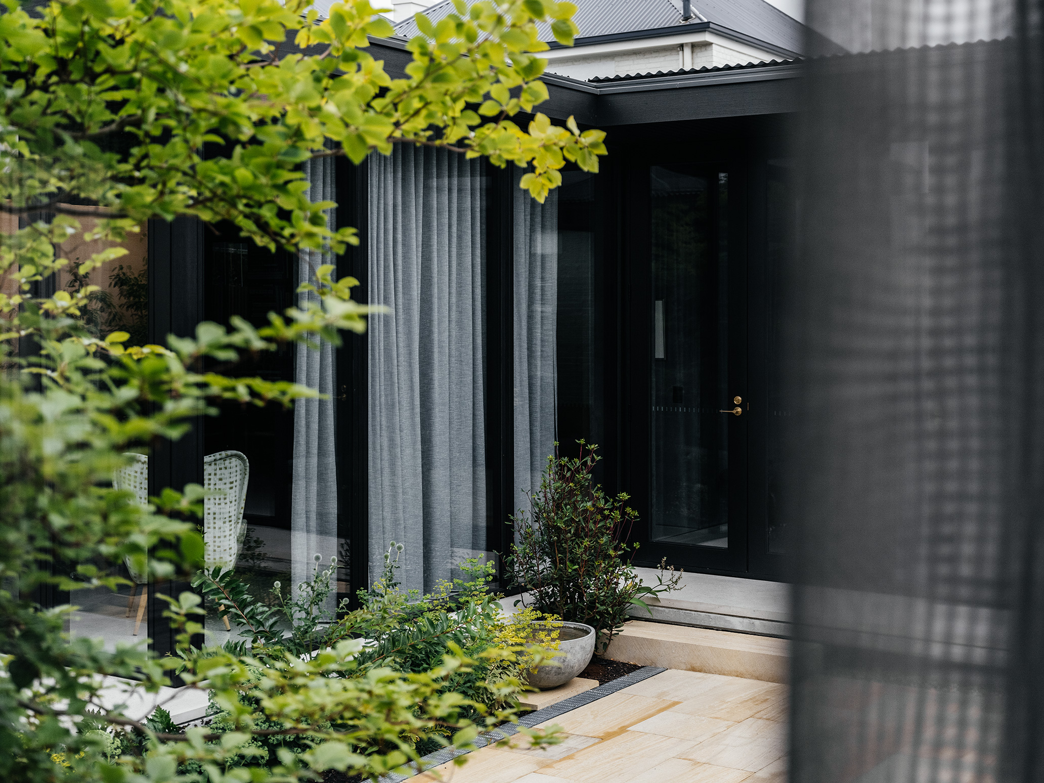 modern extension with paved courtyard