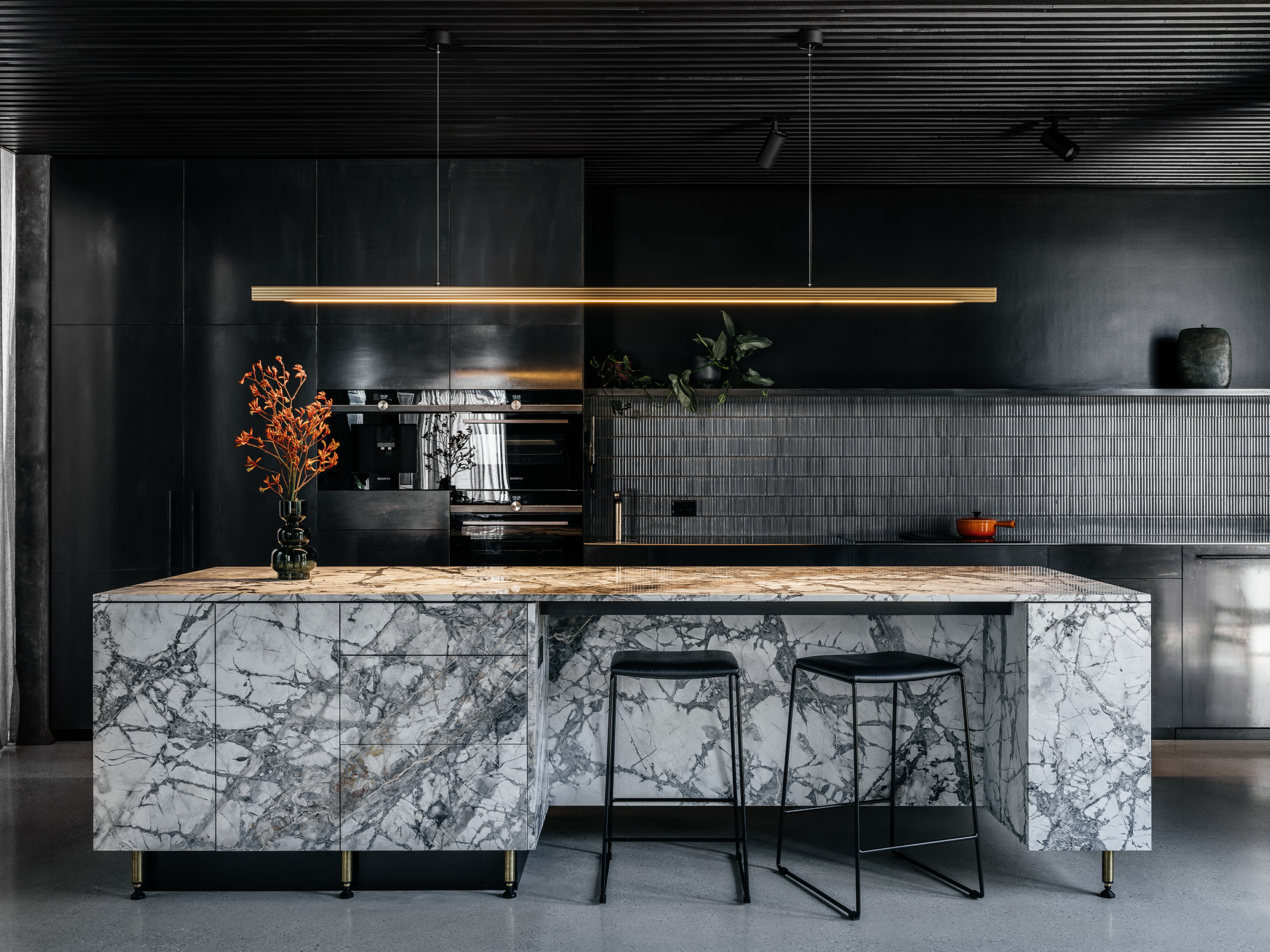 marble island bench with brass pendant