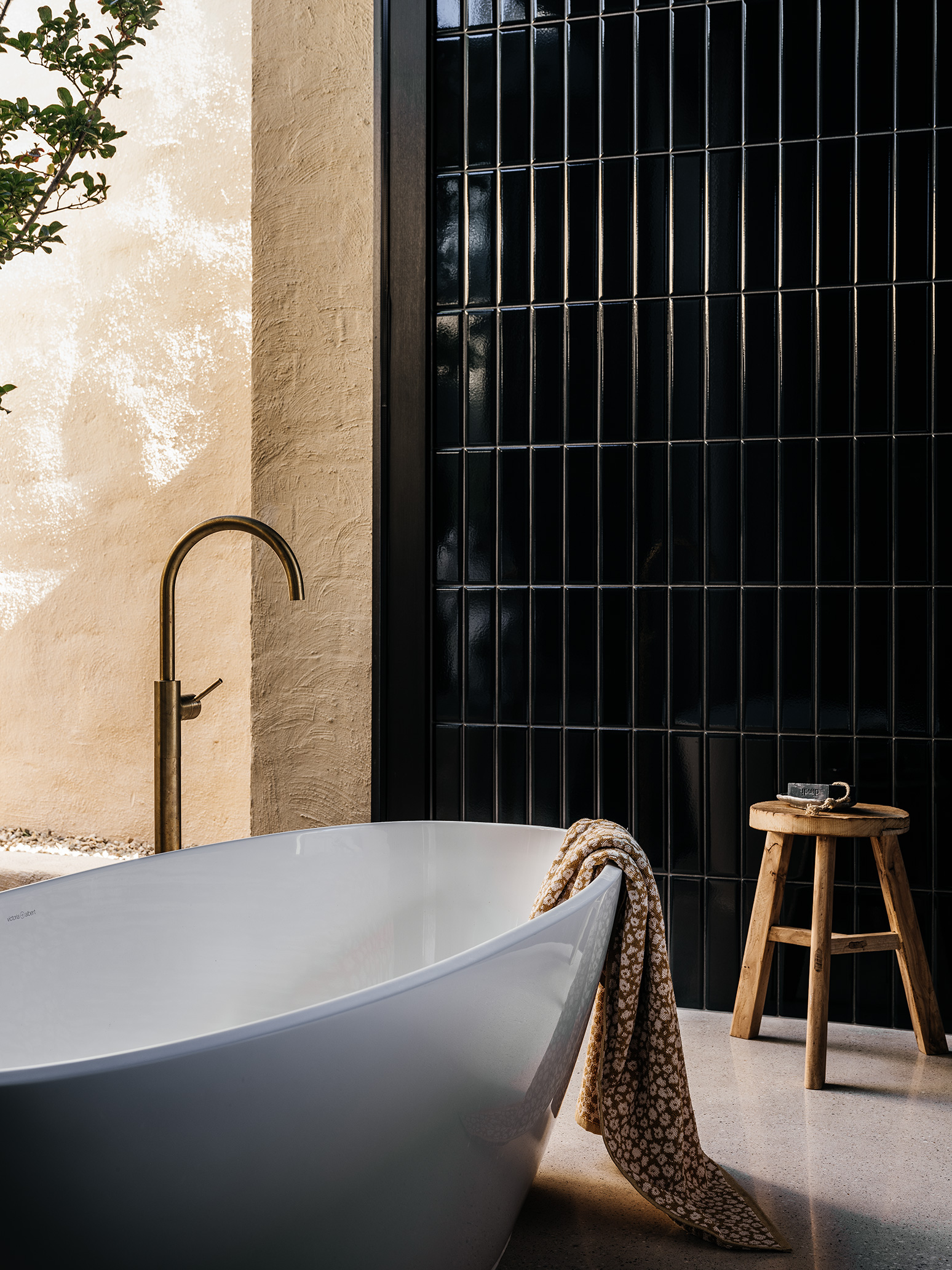 black tiled wall in bathroom