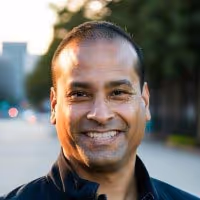 Headshot of Jeff smiling in a professional photo