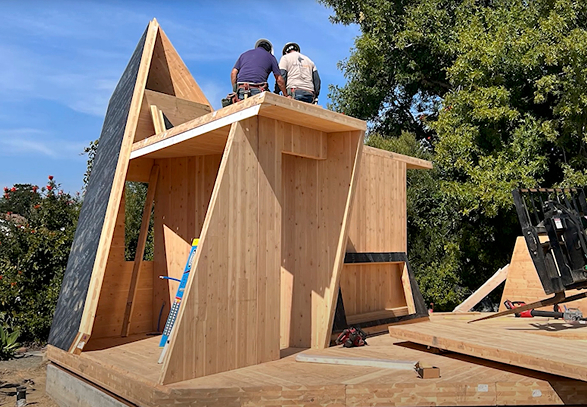 Construction workers assembling the Tetra's CLT panels on site