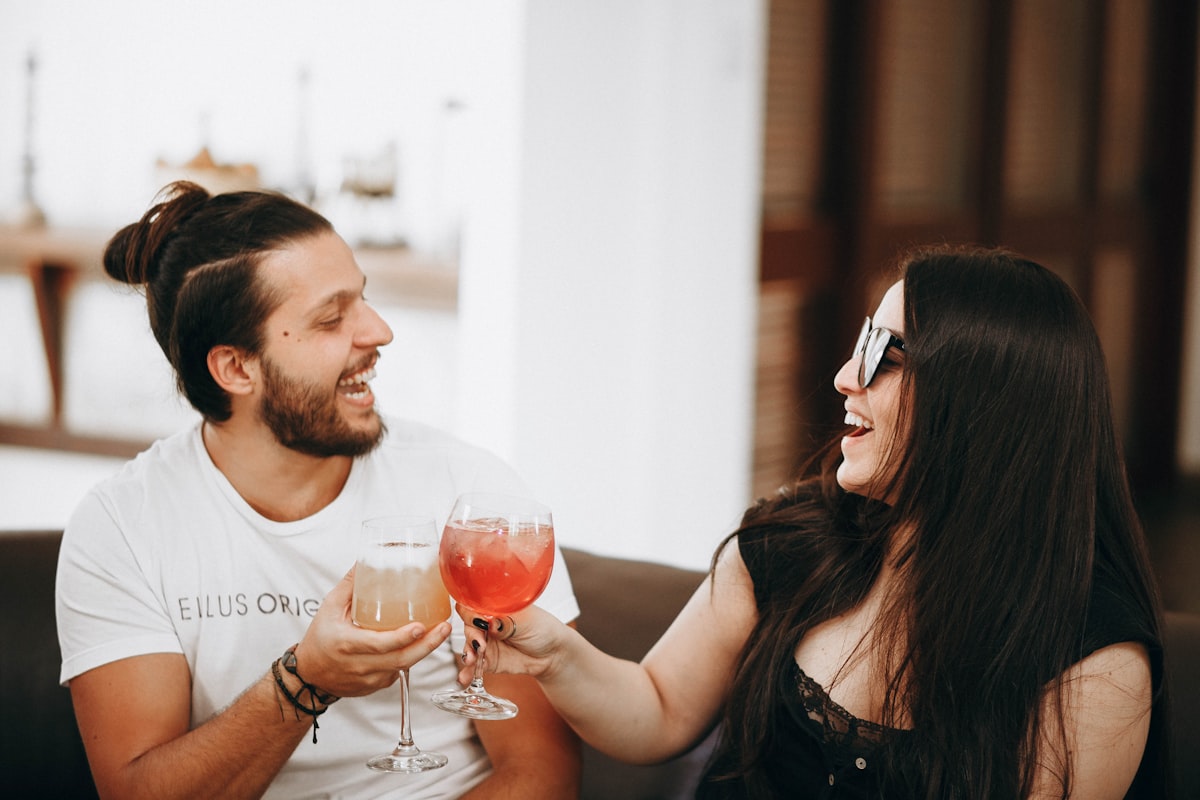 Young couple enjoying wine at a date night dinner