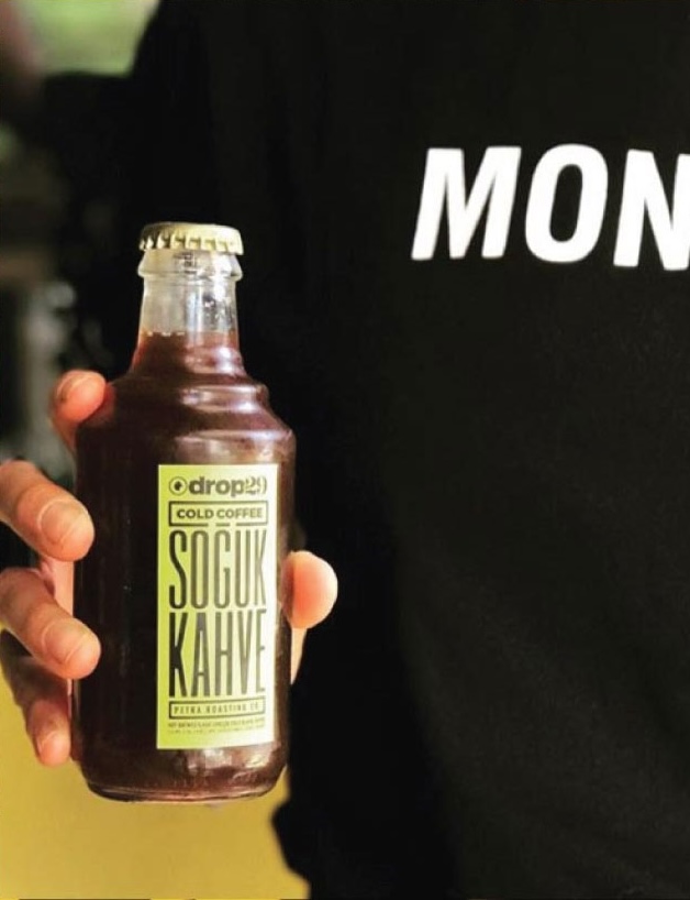 Photo of a bottled cold brew with in-house printed label — placeholder, replace with Figma export