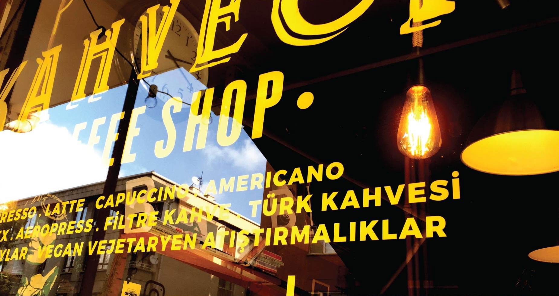 Photo of Dropin29's window lettering used as signage and menu — placeholder, replace with Figma export