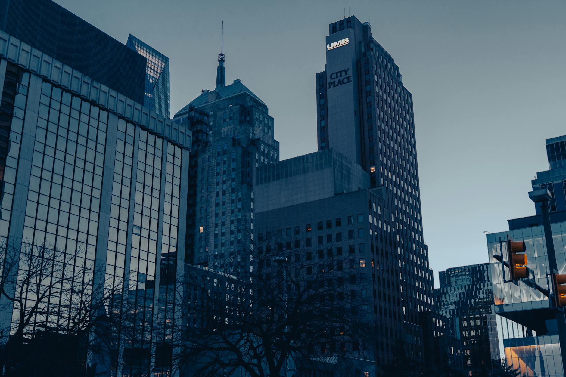 Low-angle view of Oklahoma City skyscrapers at dusk, showcasing modern urban architecture.
