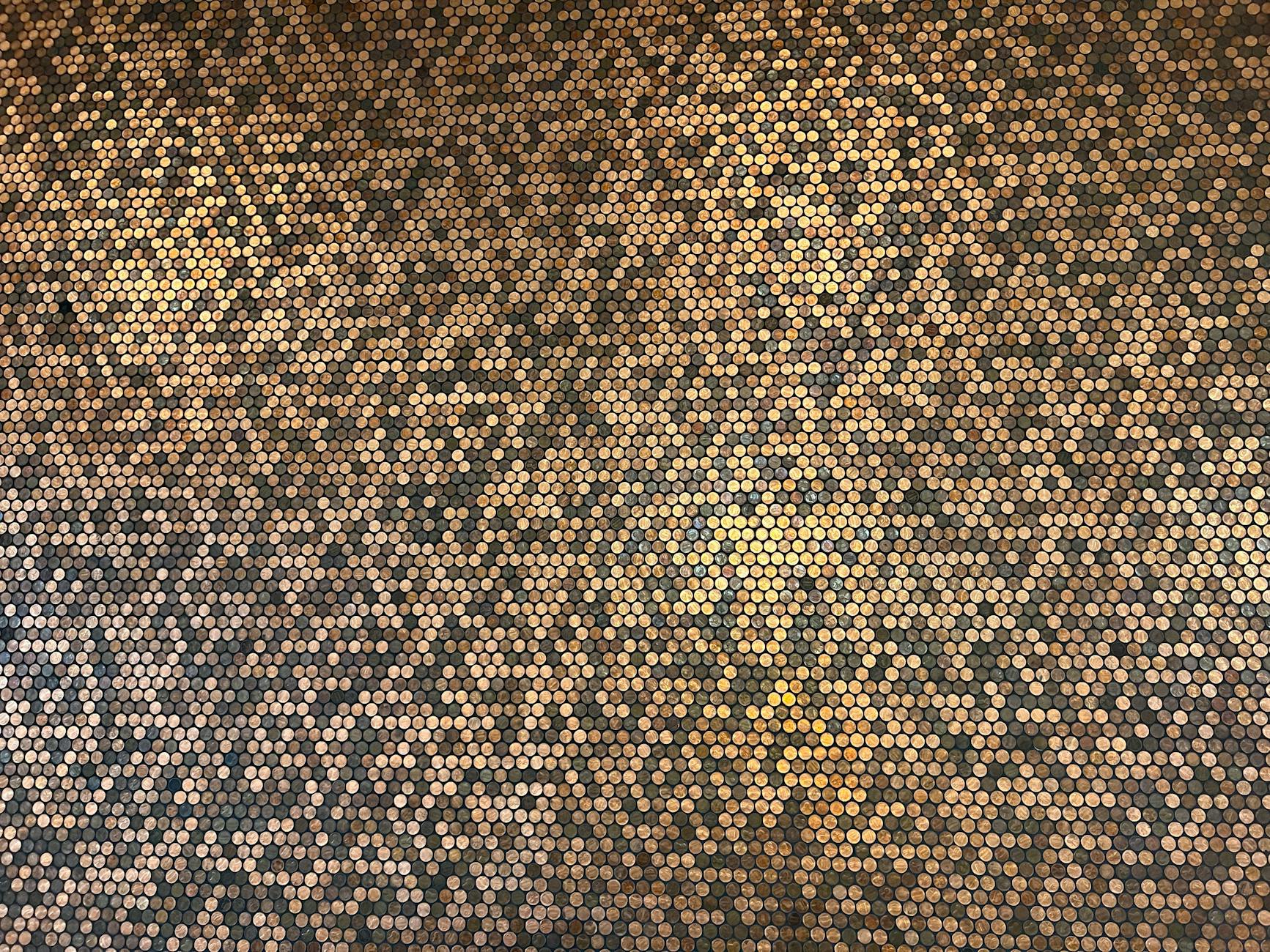 A detailed gold honeycomb pattern creating a warm, textured backdrop.