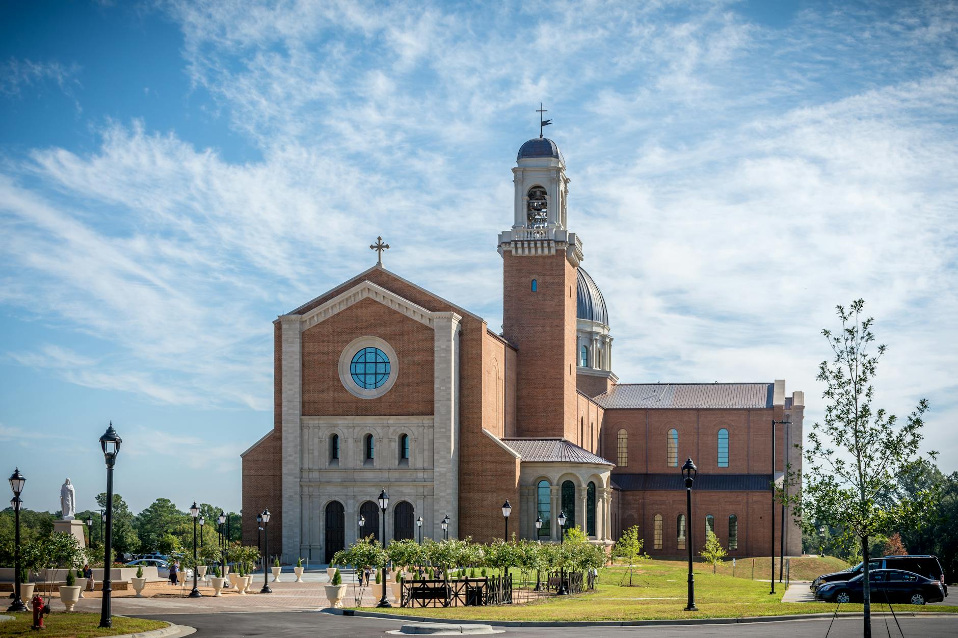 Stunning view of Saint Joseph Cathedral, Raleigh, NC highlighting its architectural beauty under a clear blue sky.