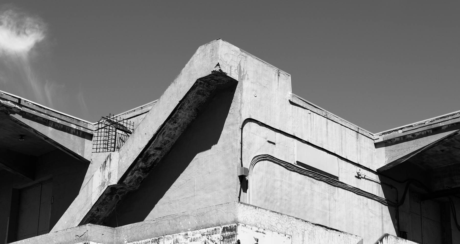 Black and white photo of a concrete building's geometric lines and shadows in Otaru, Hokkaido, Japan.