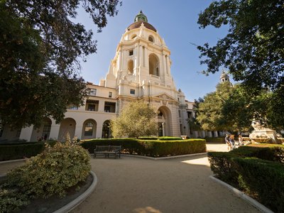 Elegant view of Pasadena City Hall with lush gardens on a sunny day.