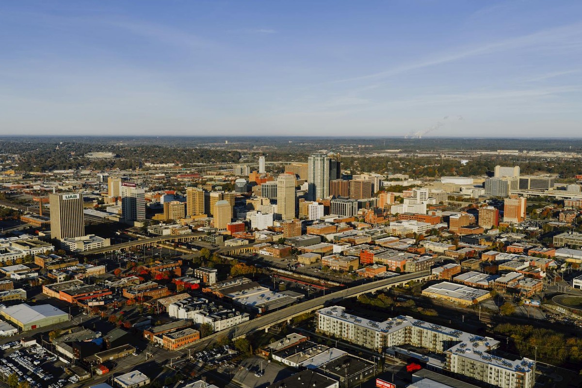 Aerial photograph showcasing Birmingham, Alabama's urban skyline and city layout.