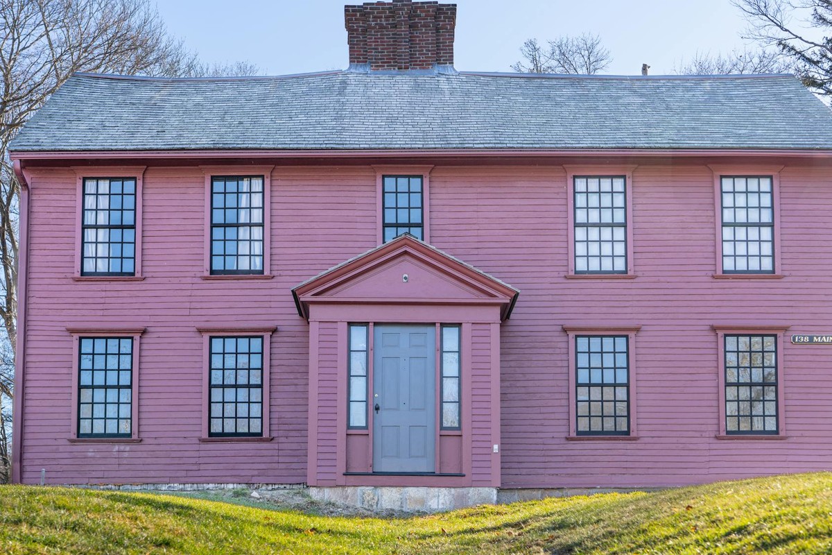 Charming historic pink house on Main Street, Sandwich, Massachusetts, with classic colonial architecture.