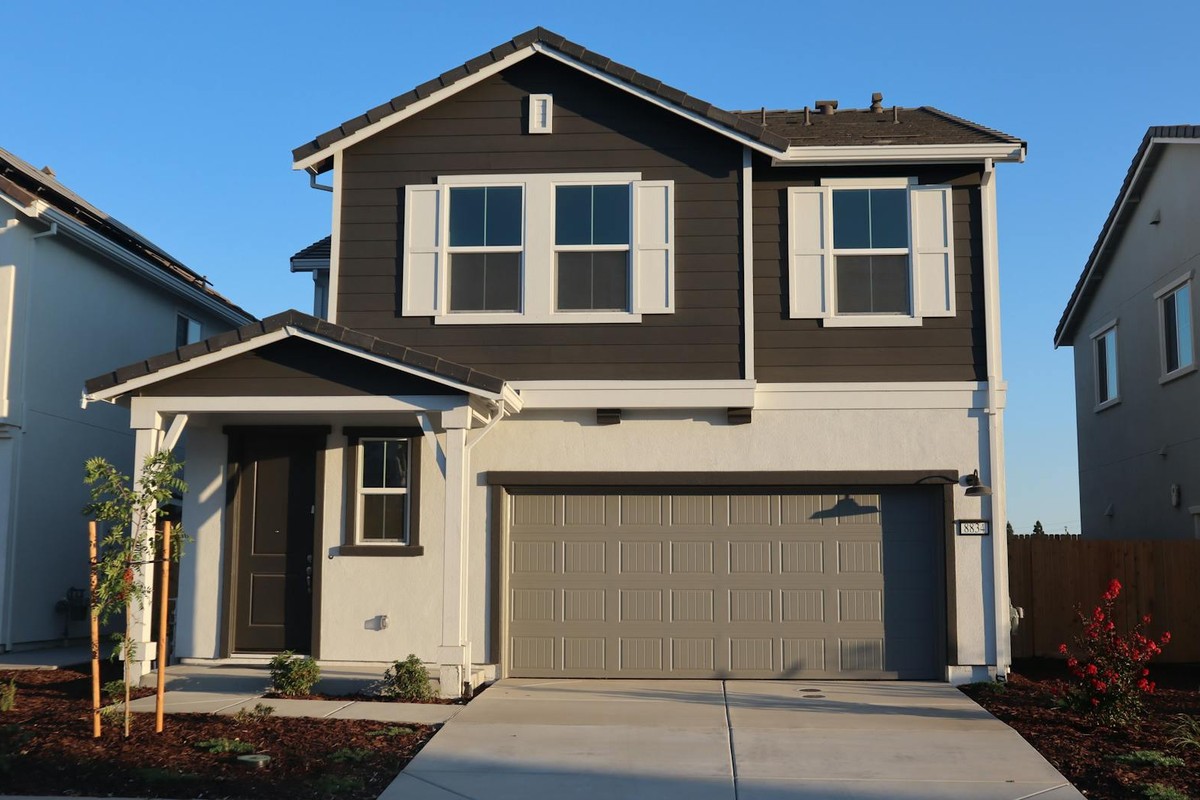 Newly constructed suburban house in Elk Grove, California, captured during daytime.
