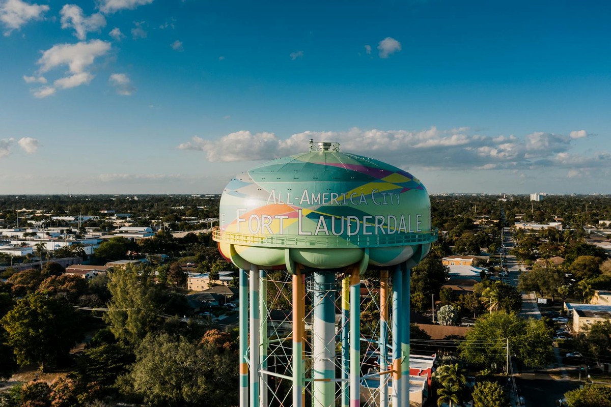 Picturesque drone view of colorful elevated water tower located against cloudy blue sky in Fort Lauderdale