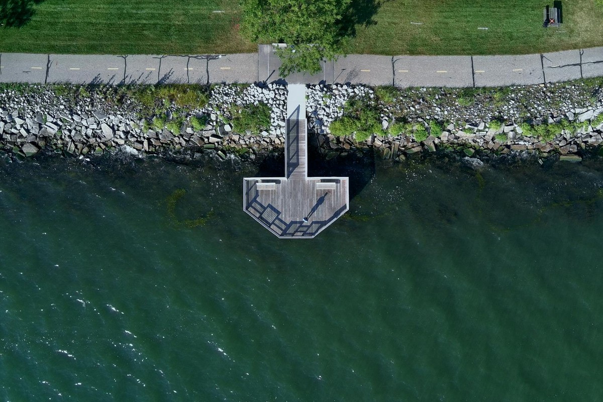 Drone shot of a pier and pathway along Detroit River in Michigan, USA.