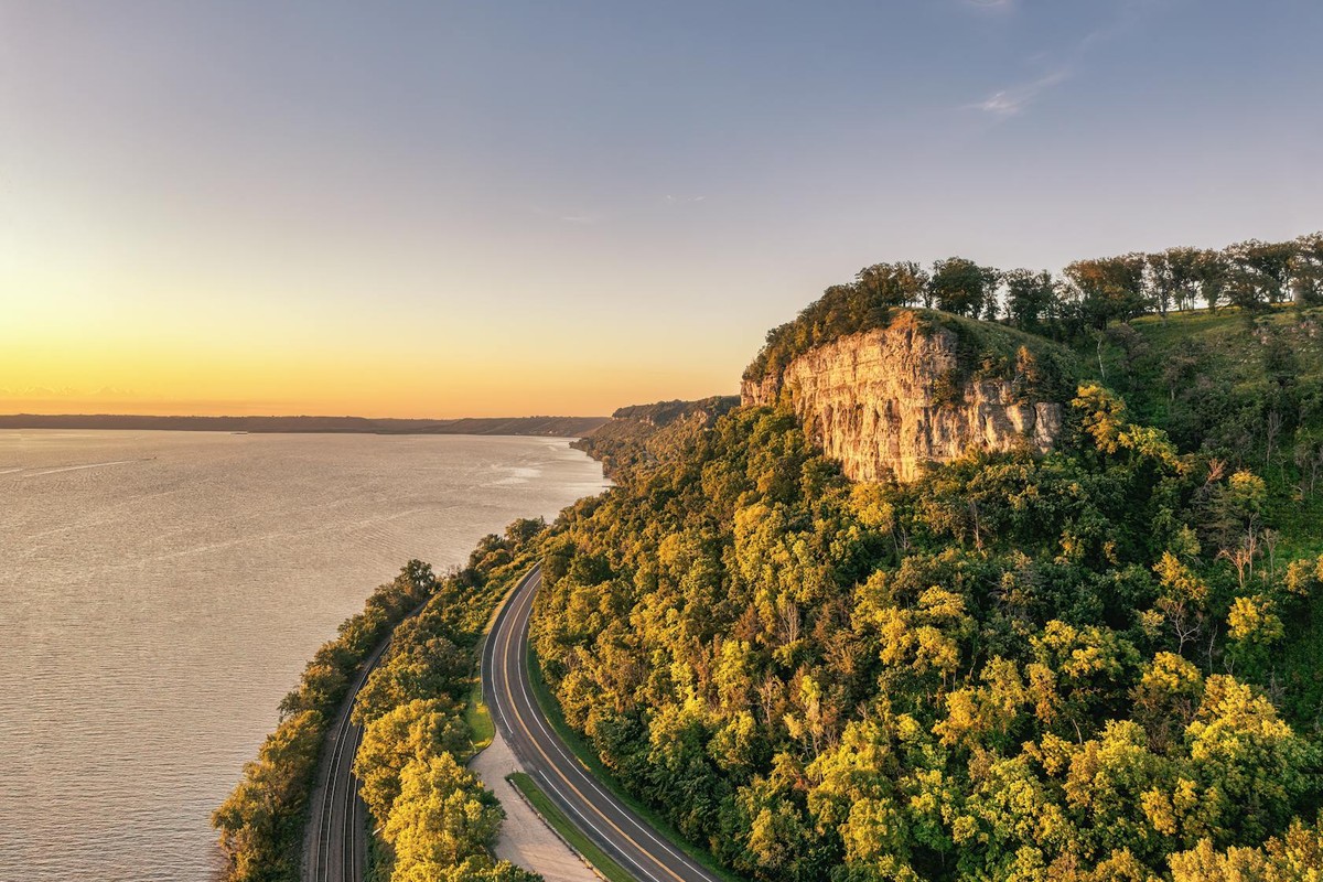 A breathtaking view of Stockholm, Wisconsin's Mississippi River bluffs at sunset, highlighting the natural beauty of the landscape.
