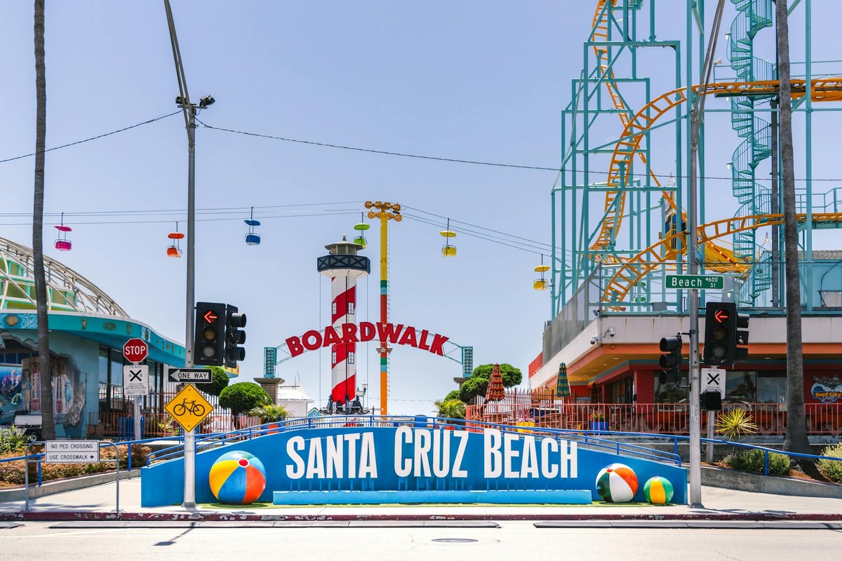 Explore the vibrant entrance of Santa Cruz Beach Boardwalk under the summer sun.
