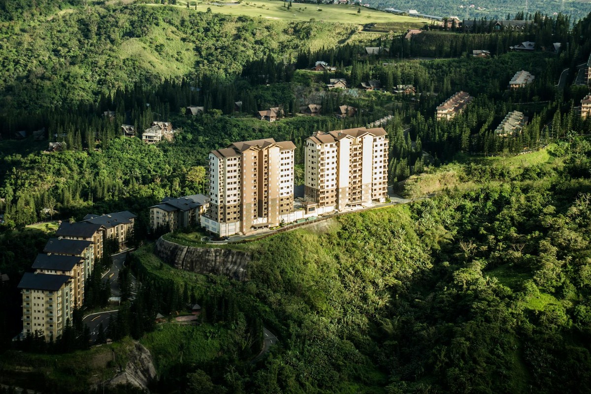 Stunning aerial view of residential buildings amidst lush greenery in Tagaytay, Philippines.
