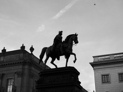 Silhouette of equestrian statue in Berlin, Germany at dusk.