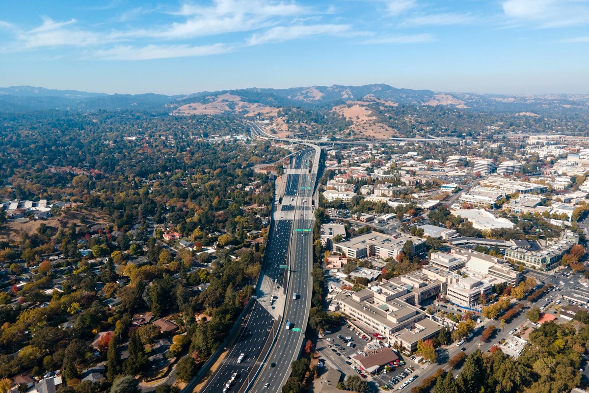 Aerial view capturing the sprawling suburbs and highway of Walnut Creek, California