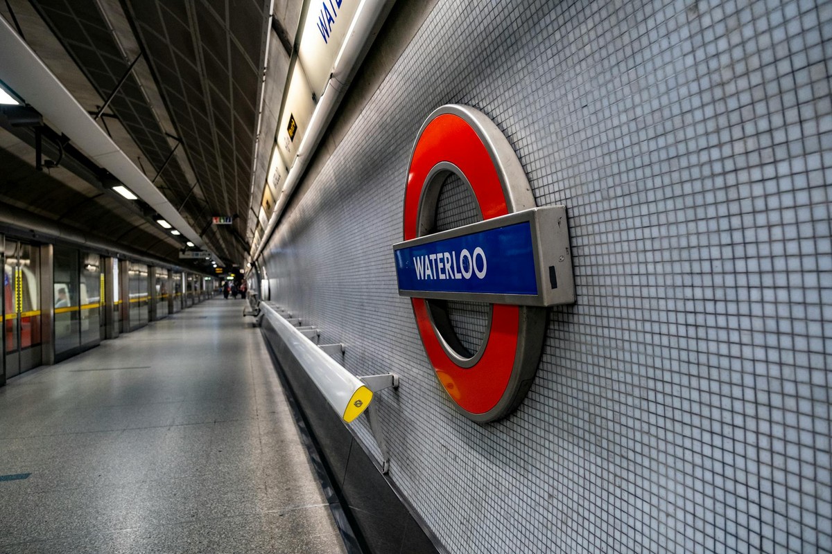 Waterloo Underground Station in England featuring the iconic tube sign.