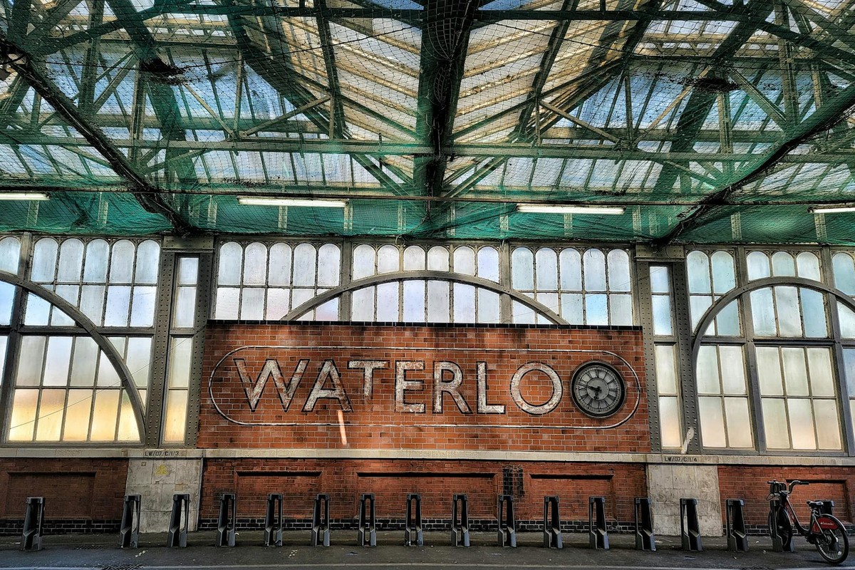 Bicycle parking area at Waterloo Station, London, showcasing industrial architecture.