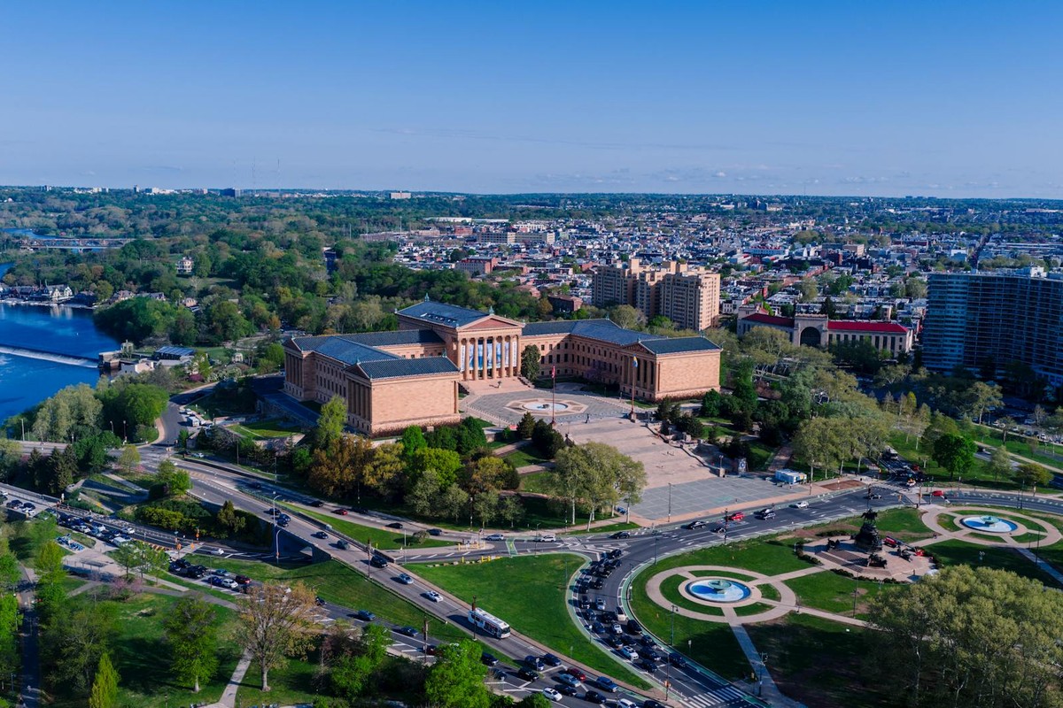Stunning aerial view of the Philadelphia Museum of Art surrounded by lush greenery and cityscapes.