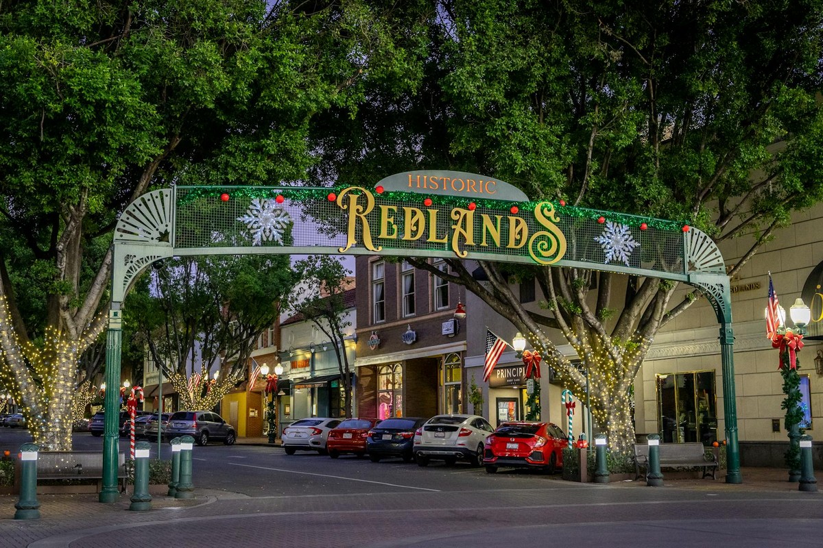 Downtown Redlands, CA adorned with Christmas lights and historic charm.