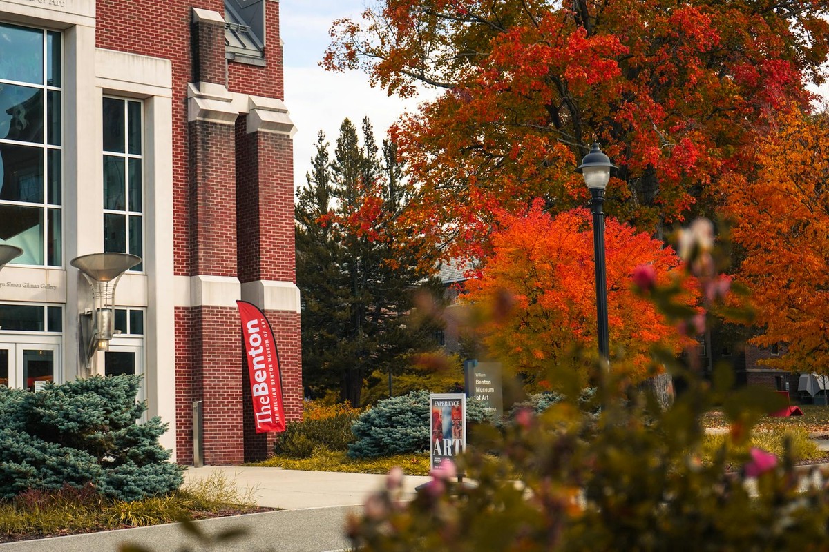 Vibrant fall foliage at the University of Connecticut campus showcasing the Benton Museum of Art.