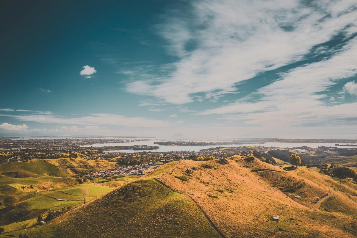 Beautiful aerial view of the rolling hills and cityscape in Tauranga, Bay of Plenty, New Zealand.