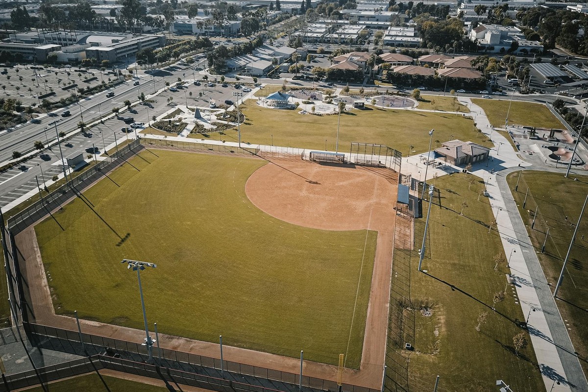 Captivating aerial shot of a baseball field set in an urban sprawling city park.