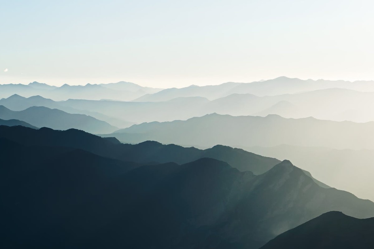 Breathtaking aerial view of the misty mountain ranges in Santiago de Querétaro, Mexico at dawn.