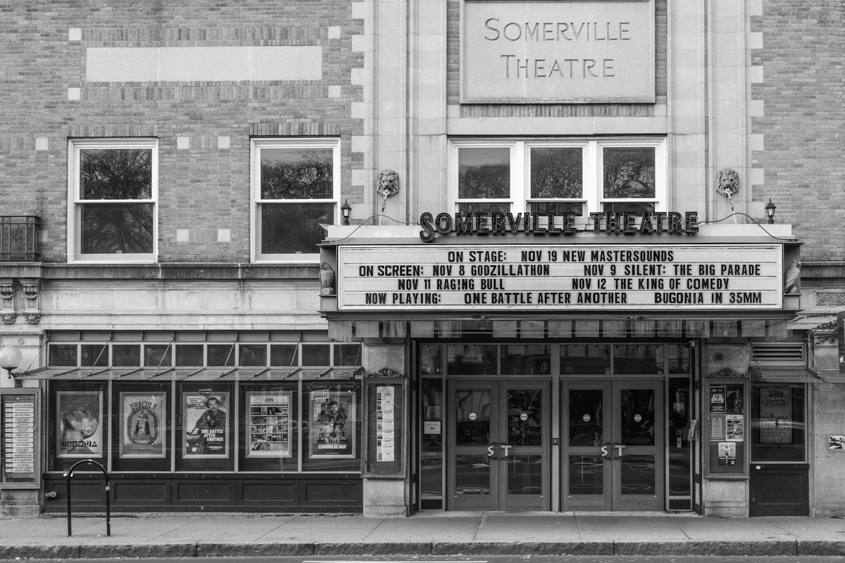 Front view of Somerville Theatre in Massachusetts with event marquee, black and white photo.