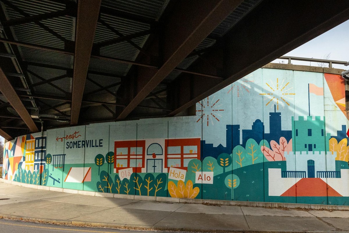 Vibrant street art mural showcasing community spirit in East Somerville, Massachusetts.