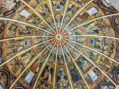 Intricate frescoes decorate the dome of the Parma Cathedral, Italy.