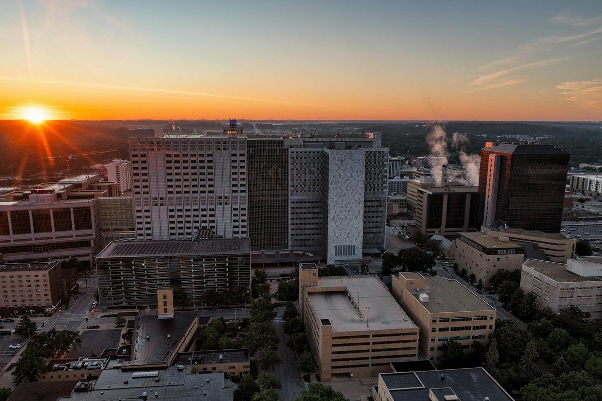 Aerial view of Rochester, Minnesota's skyline at sunset, showcasing modern architecture.