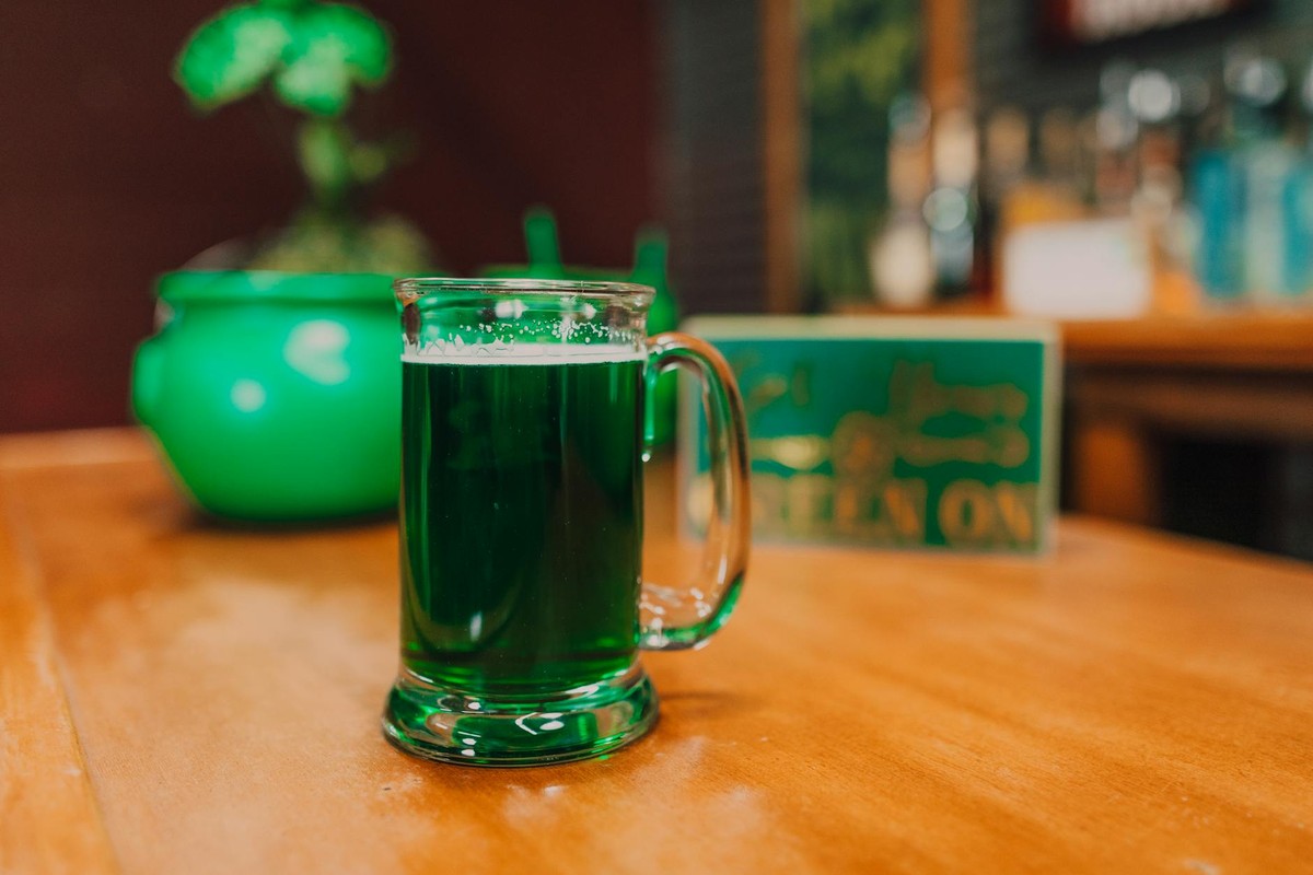 Close-up of a green beer mug on a wooden table, perfect for St. Patrick's Day celebration.
