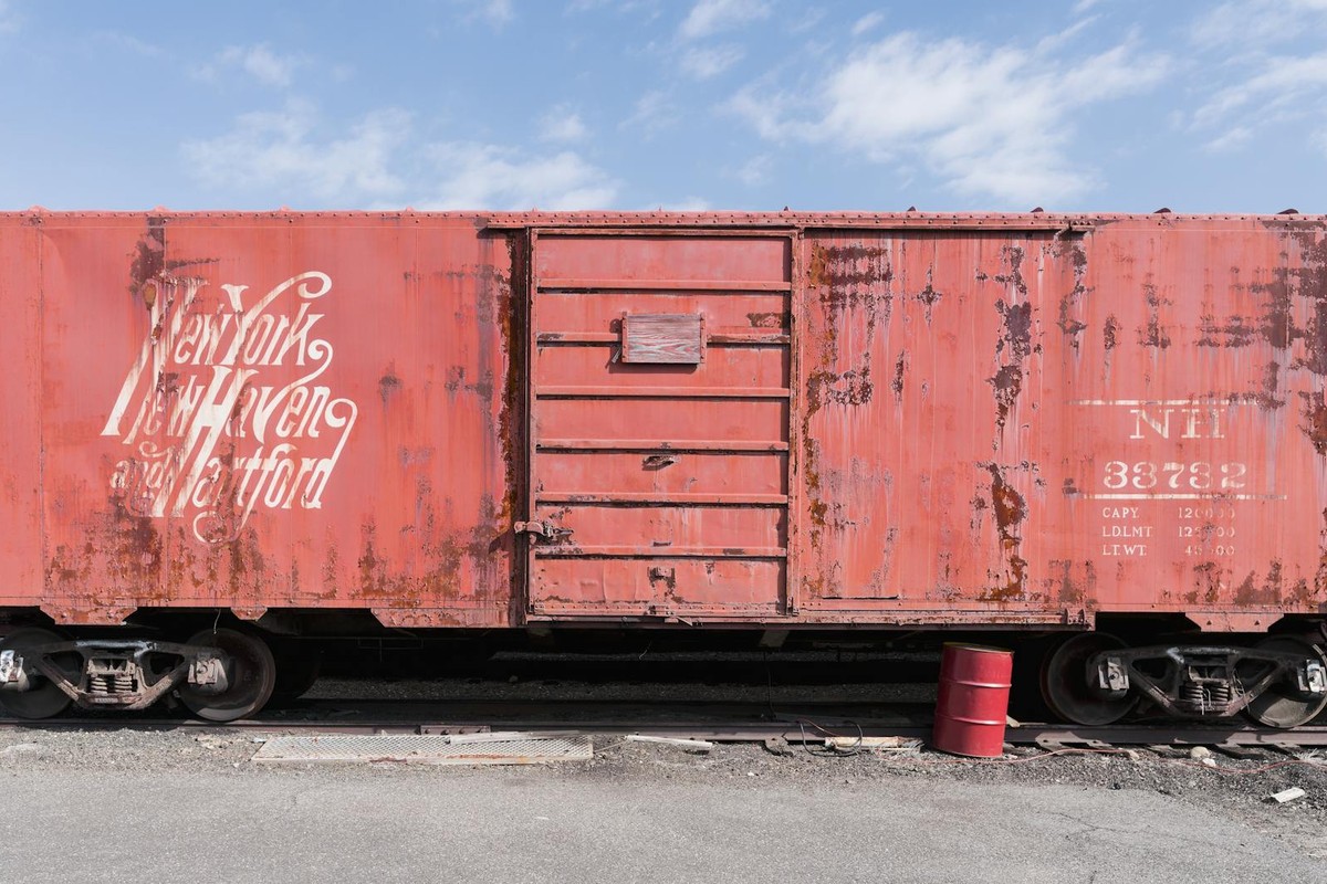 Rustic vintage boxcar at Danbury Railway Museum, showcasing historical railway design.