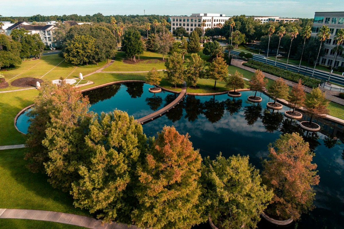 Beautiful aerial view of a park with a pond in Lake Mary, Florida, showcasing autumn foliage.