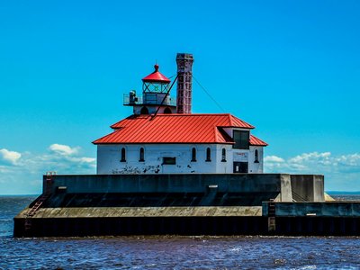 Vibrant view of the iconic Duluth lighthouse, Minnesota under a clear sky.