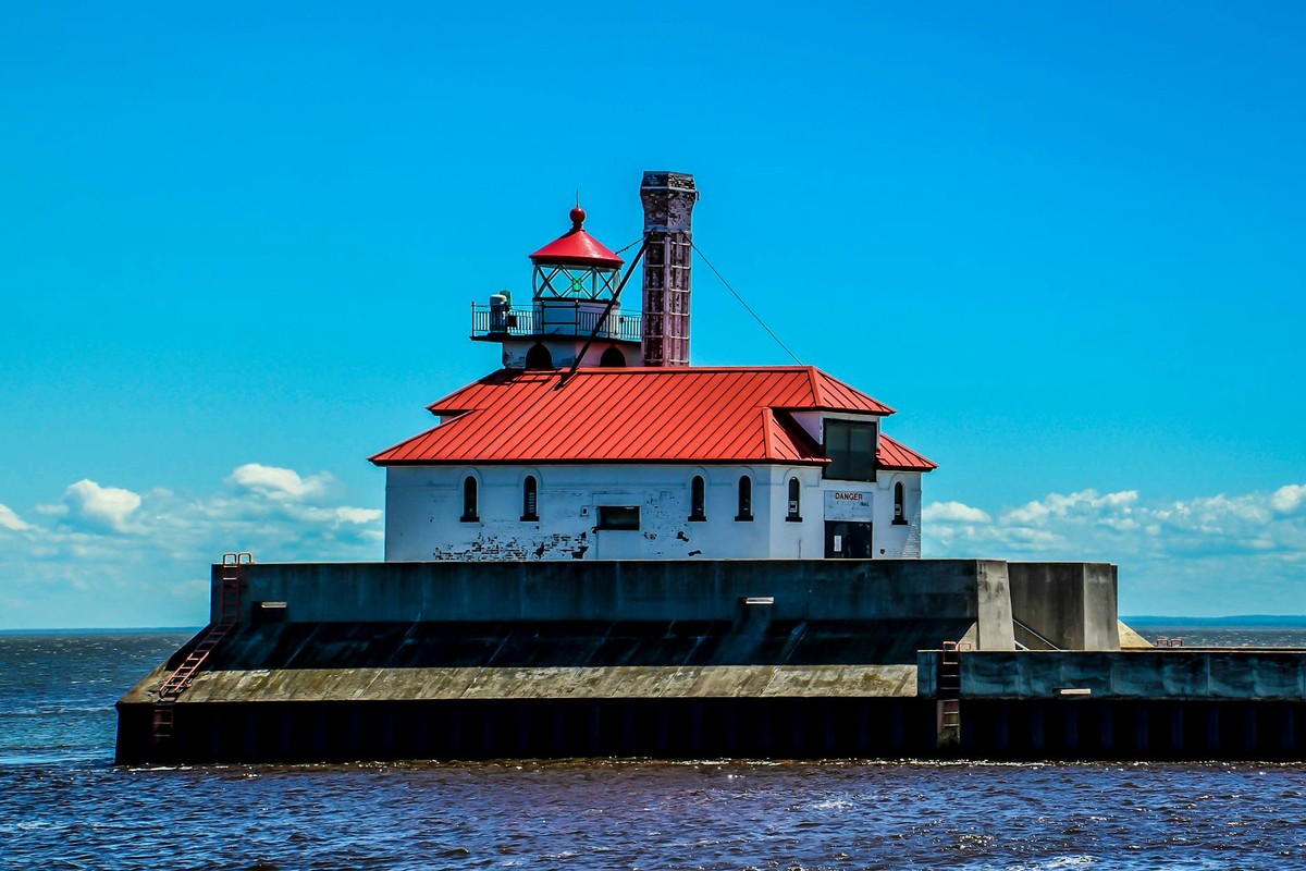 Vibrant view of the iconic Duluth lighthouse, Minnesota under a clear sky.