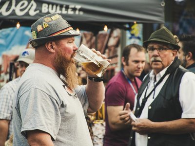 A lively scene at Oktoberfest in Nampa, Idaho featuring people enjoying beer outdoors.
