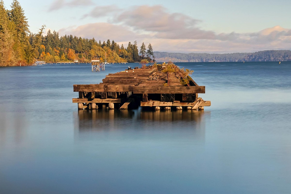 Tranquil scene of an old pier on a calm day at Ruston Way Waterfront, Olympia, Washington.